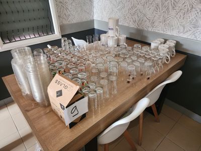 a table with a lot of empty glasses on it