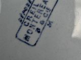 a close up of a plate with a chinese writing on it