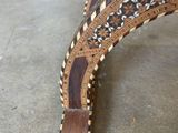 a bench made out of wood with a pattern on it
