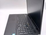 a black laptop with a blue sticker on the screen