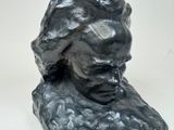 a statue of a woman that is sitting on a table