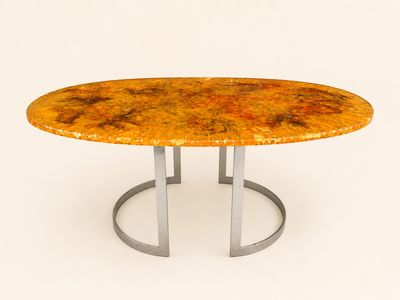 une table ronde avec un piètement en métal et un plateau en marbre