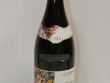 a bottle of wine that is sitting on a table