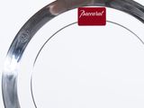 a silver plate with a red tag on it