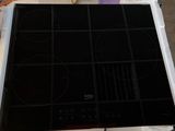 an image of a stove top with a black burner on top of it