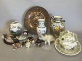 many different types of vases and plates on the table
