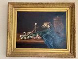 un tableau représentant des oignons et une bougie posés sur une table