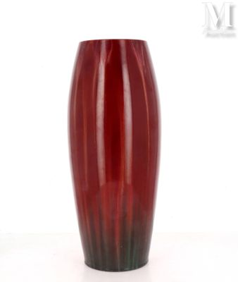 a red vase that is sitting on a table
