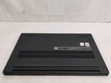 a laptop that is sitting on a white surface