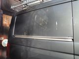 a black van parked in front of a building