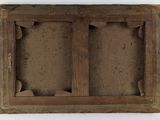 an old picture of a wooden frame with rocks in the middle of it