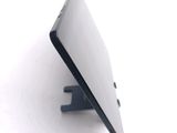 a close up of a cell phone on a stand
