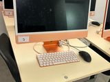 two computer screens on the desk with a keyboard and mouse