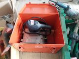 a box that has a drill and other tools in it