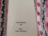 an image of a white tag on a pink and blue blanket