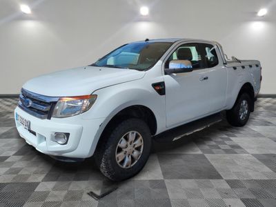 a picture of a white pickup truck parked in a garage