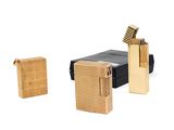 two lighters that are next to each other on a white surface