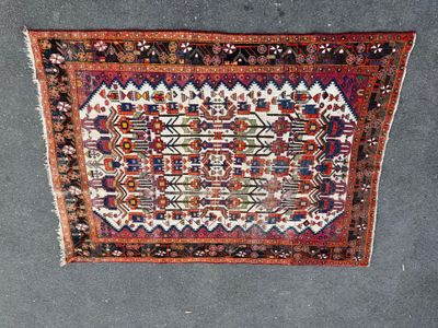 an old rug with a design on it on the floor