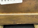 an image of a close up of a wooden box with a price tag on it