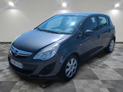 a picture of a grey car parked in a garage