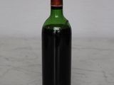 a bottle of wine that is sitting on a table