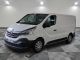the white van is parked on a checkered floor in a room