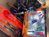a cardboard box filled with assorted items in it