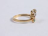 an image of a gold ring with a flower design on it
