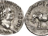 a close up of a silver coin with an image of a man on a horse