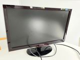a flat screen tv sitting on top of a white table
