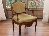 a chair that is sitting in front of a window