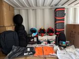 many boxes and bags in the back of a moving truck