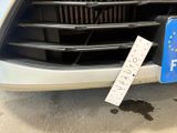 a car with a sticker on the front of it