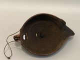 an image of a brown bowl on a white surface