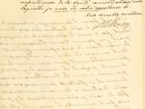 un vieux document écrit posé sur une table