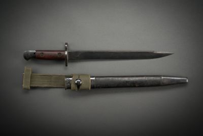 two knives that are laying next to each other on a table