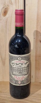 a bottle of wine that is sitting on a table