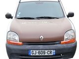 a brown van parked on the side of the road