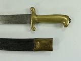 two different types of knives on a white surface