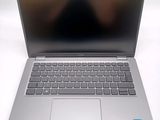 an open laptop computer sitting on top of a white table