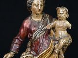 an image of a statue of a woman holding a child
