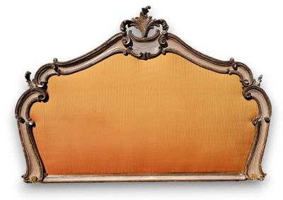an antique mirror with a gold frame and a clock on it