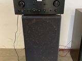 two speakers sitting on top of each other in a room