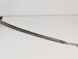 a sword with a skull on it on a white surface