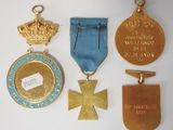 some of the medals are on display on a white surface