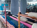 a mannequin in the middle of a room with many different types of clothing