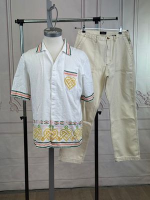 a mannequin with a shirt and pants on a stand