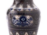 a blue and white vase sitting on a white surface
