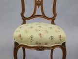 an image of a chair with a floral upholstered seat