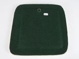 the back of a green seat cushion with a ring on it